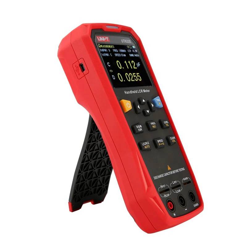 Angled view of the portable UNI-T UT622E LCR meter with its kickstand deployed, demonstrating its flexible design for lab or field use.